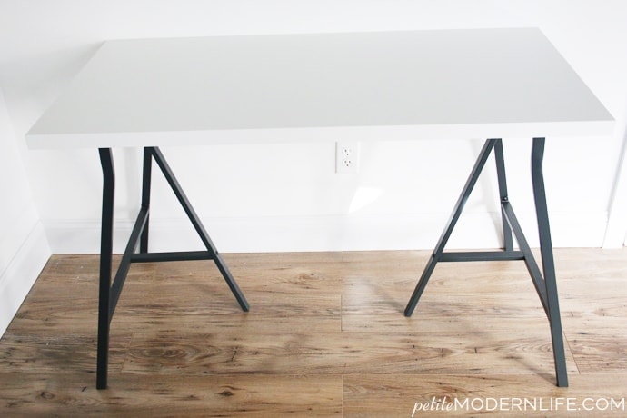 Build your own modern + sleek desk for as low as $26 (like this pretty one with trestle legs + white table top!)