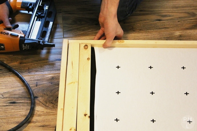 This DIY Sliding Fabric Door is a great idea if you want to save money on a barn door!