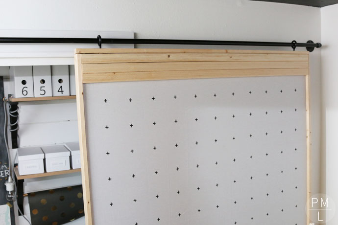 This DIY Sliding Fabric Door is a great idea if you want to save money on a barn door!