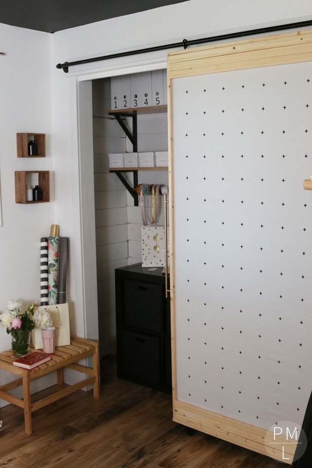 This DIY Sliding Fabric Door is a great idea if you want to save money on a barn door!