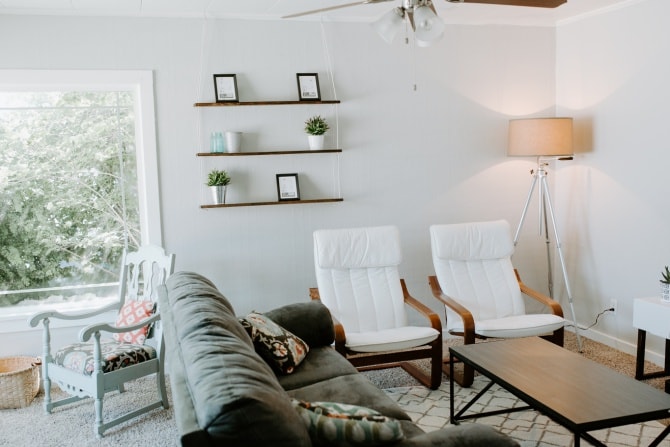 hanging rope shelf DIY with matching chairs and gray couch