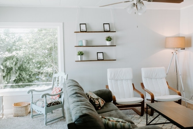 hanging rope shelf DIY with matching chairs and gray couch