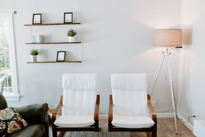 hanging rope shelf DIY with matching chairs and industrial lamp