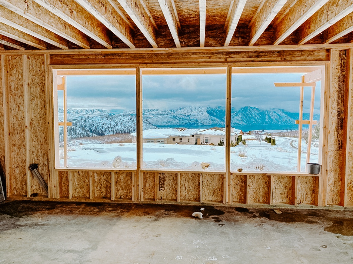 European Farmhouse looking out living room picture windows