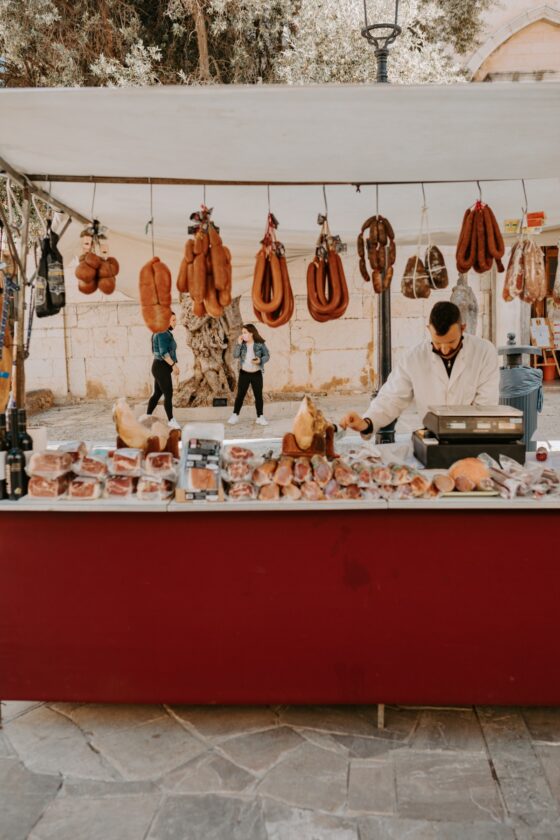 Meat vendor at the Inca Market in Mallorca Spain