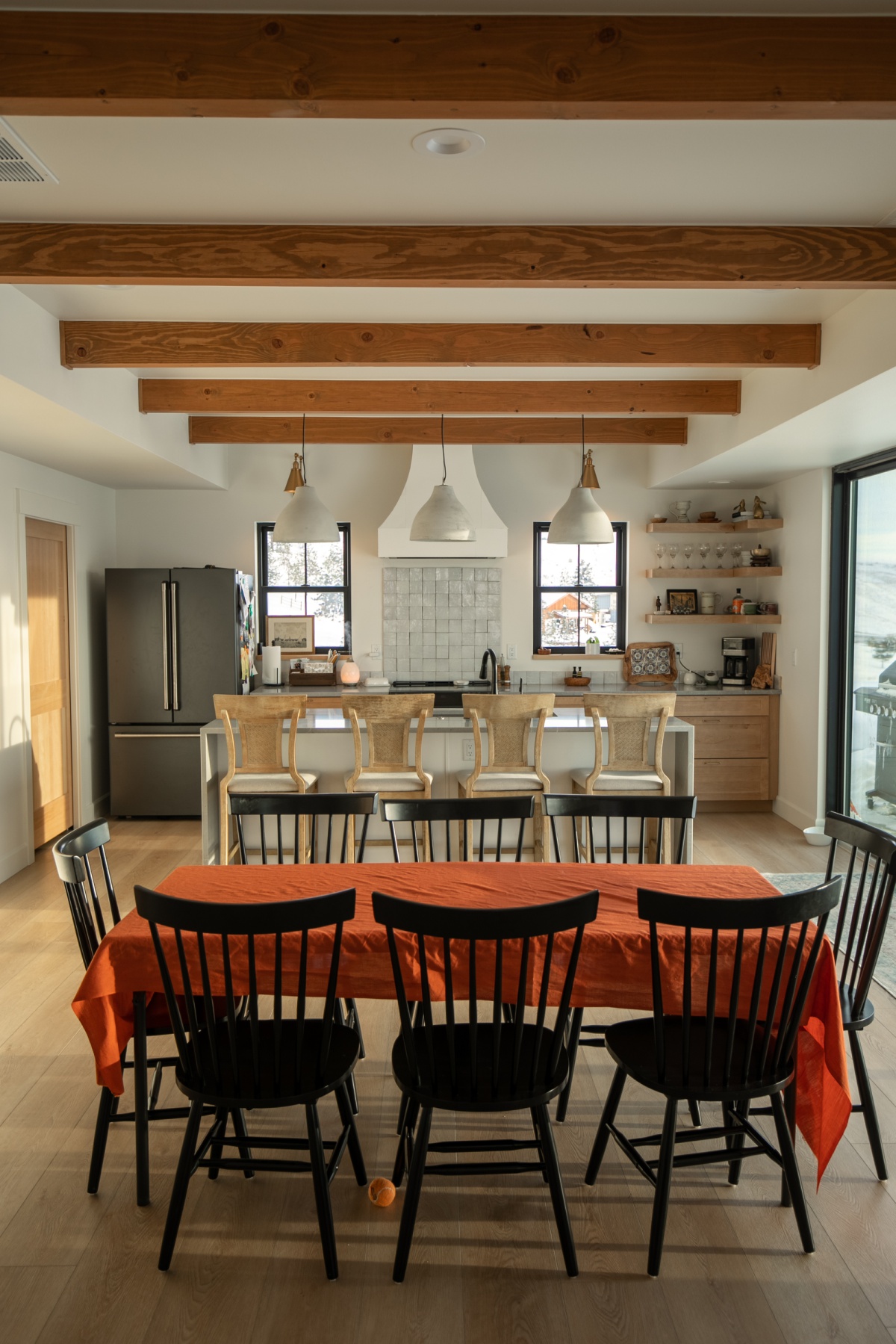 In progress dining room photo with chairs and backsplash visible.