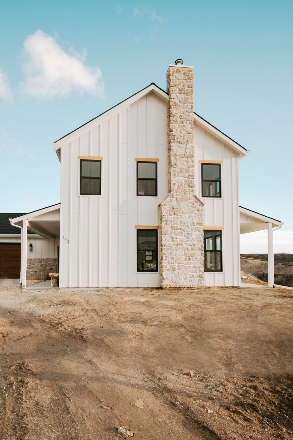 stone chimney on white farmhouse