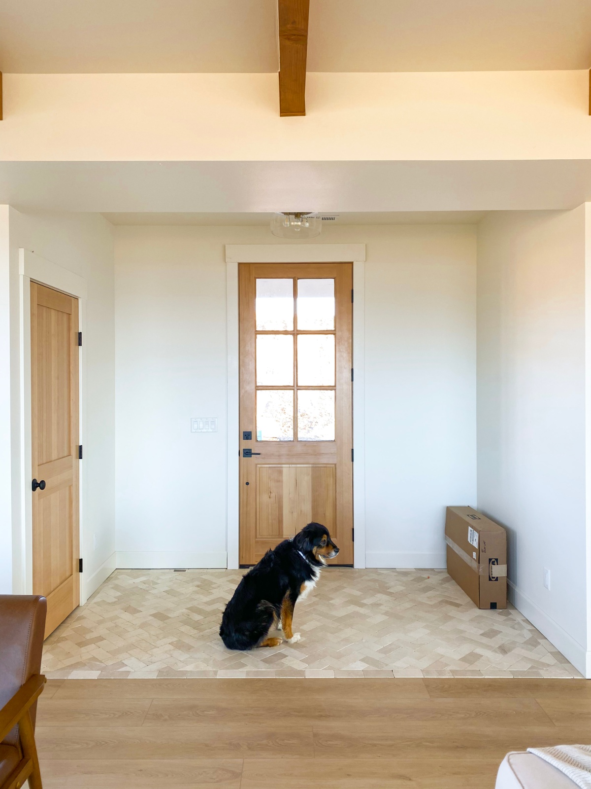 Entryway with stone floors and farmhouse door